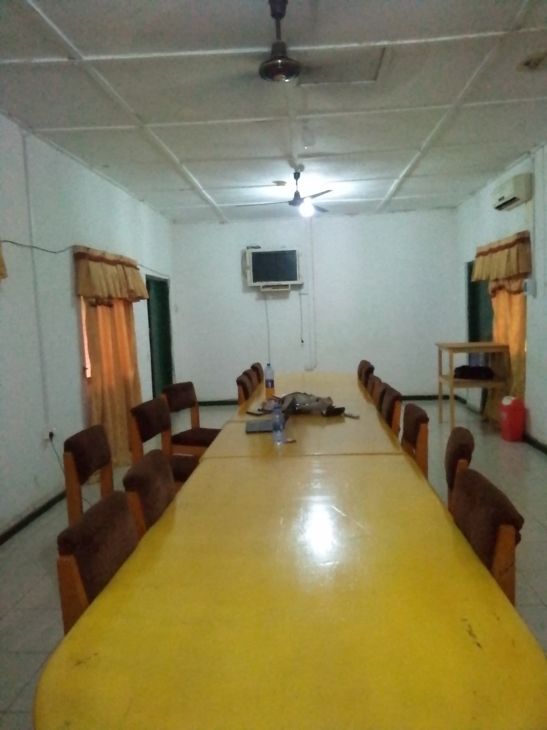 Empty conference room with a long table and chairs