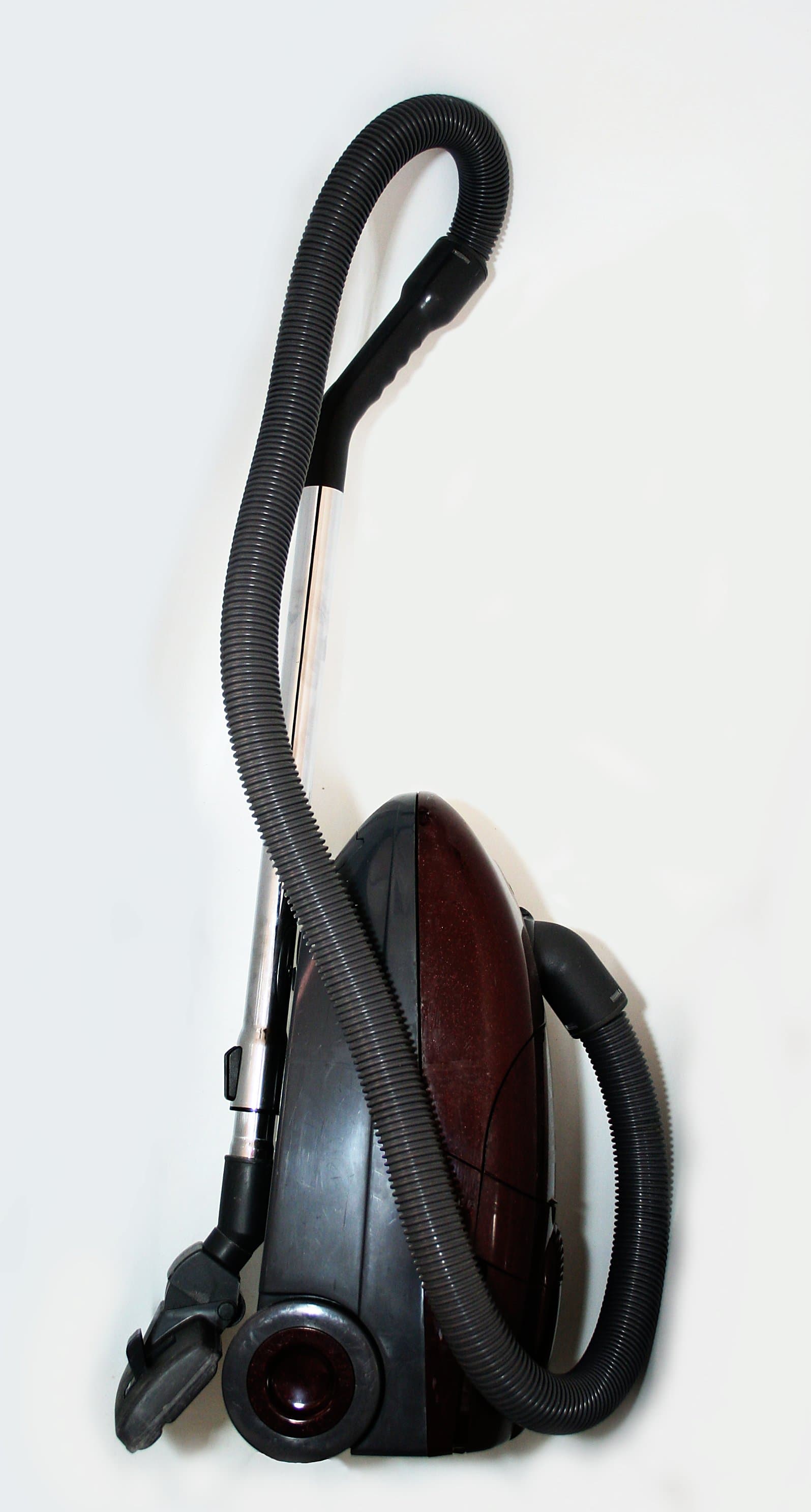 Upright vacuum cleaner used on indoor flooring